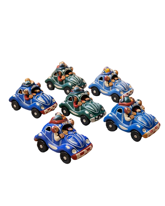 Set of decorative toy cars on a wooden surface