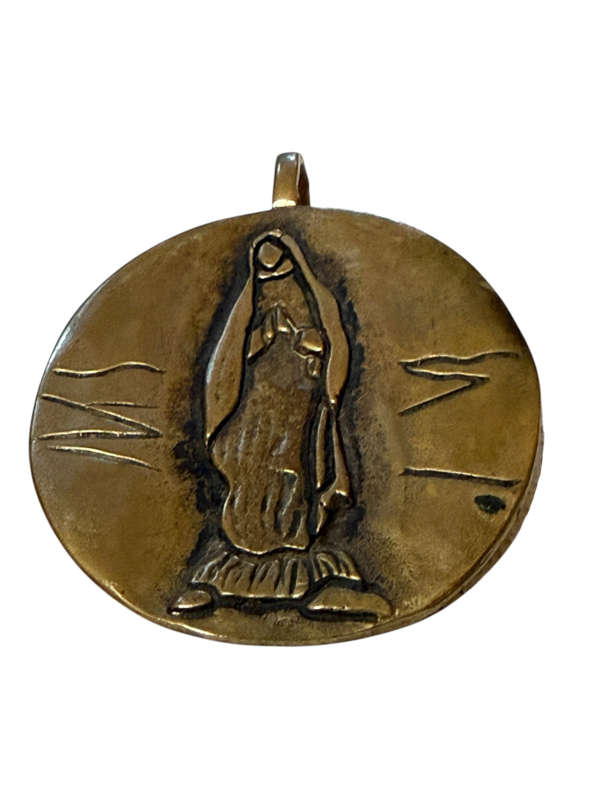 Front of gold-toned Our Lady of Guadalupe medal pendant